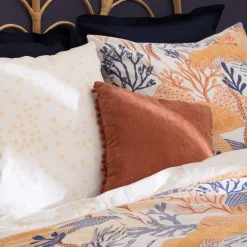 Coussin pompons