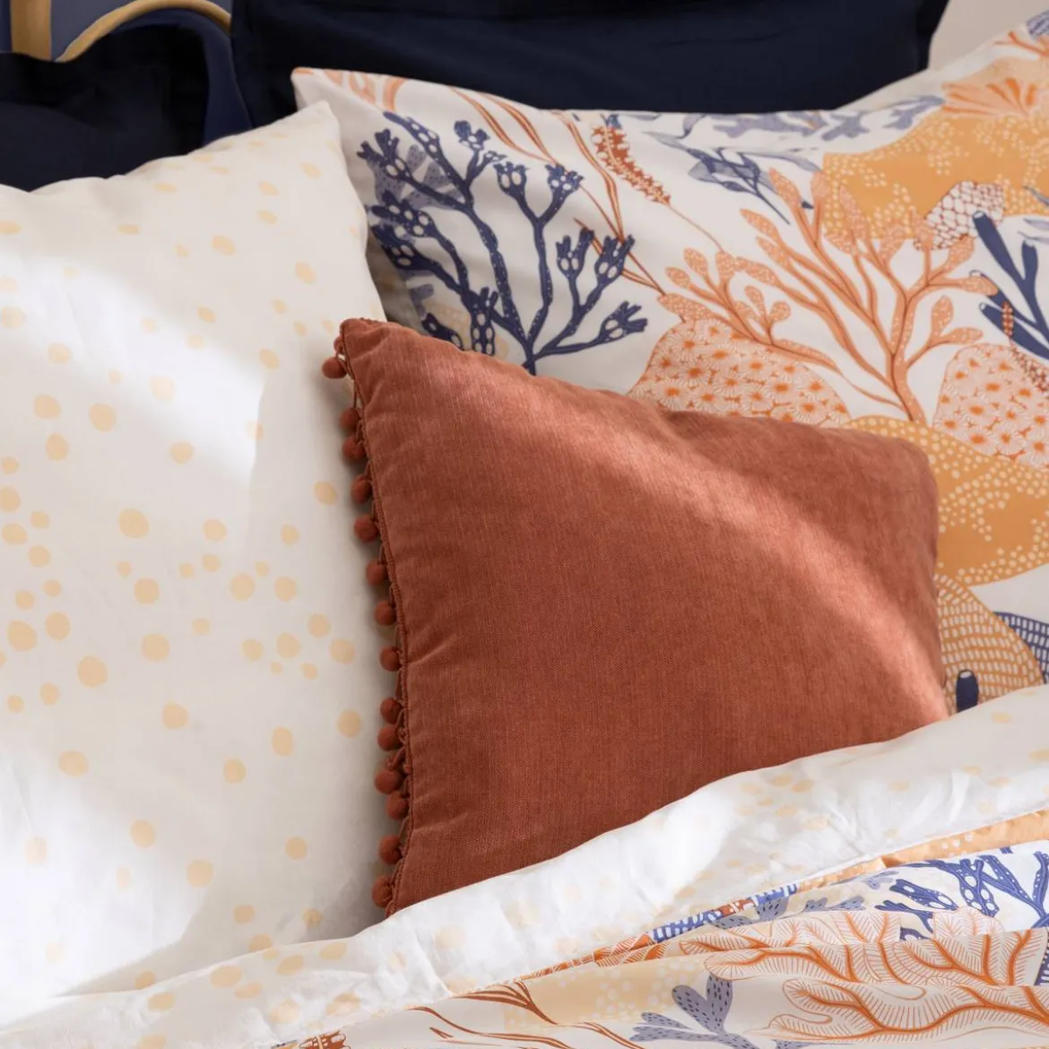 Coussin pompons