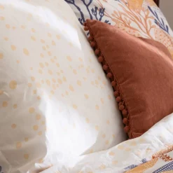 Coussin pompons